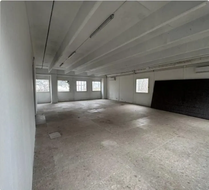 Open production hub space with concrete floor