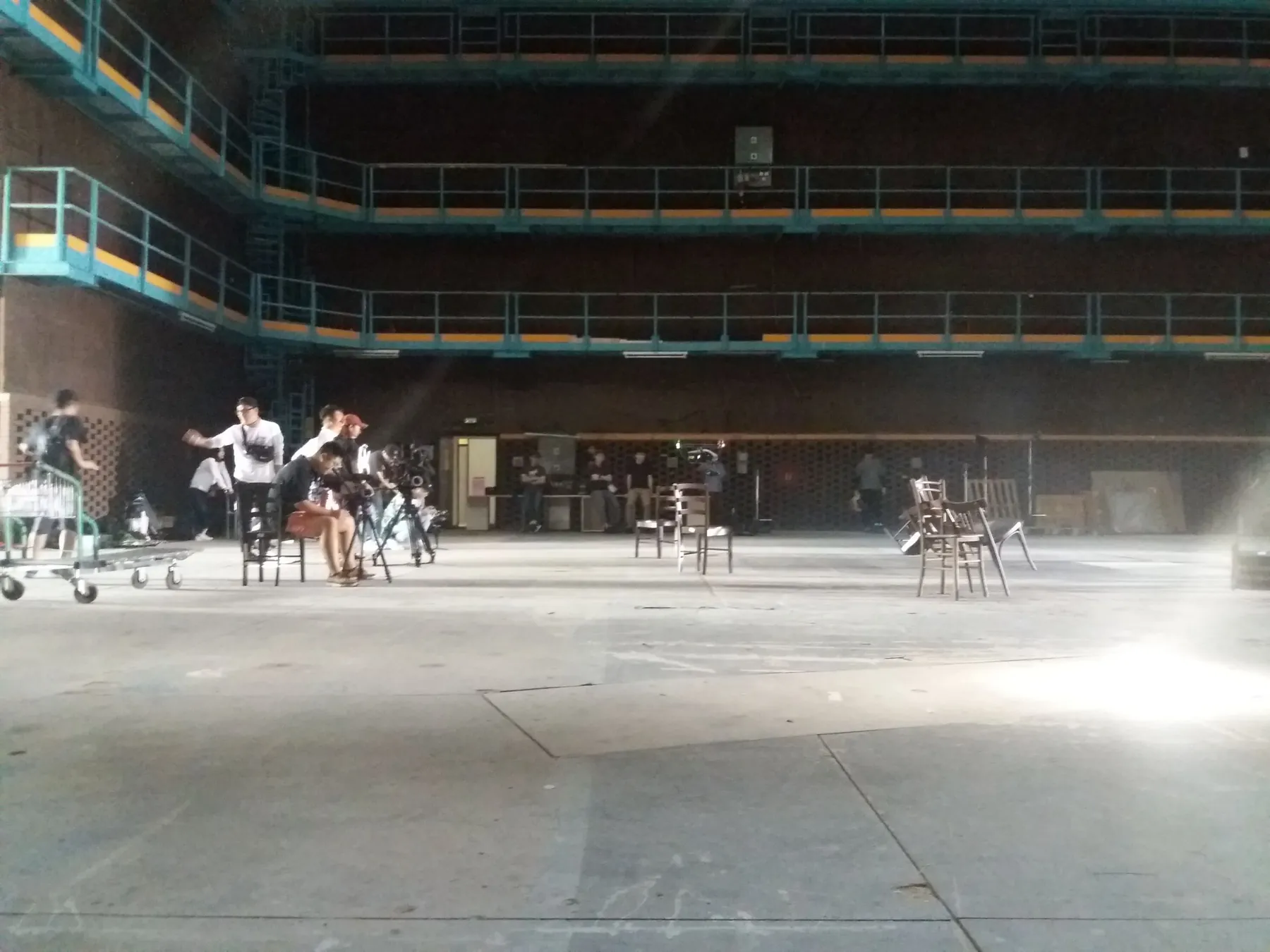 Stage rigging and beams of production light